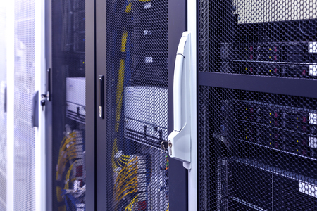 racks of Servers With Electric Plugs Above